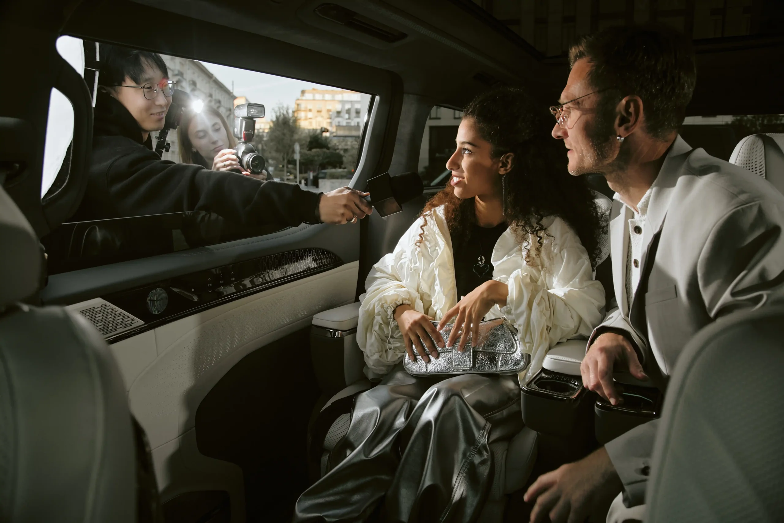 stylish-woman-and-man-in-car-interviewed-2026-03-19-10-49-11-utc