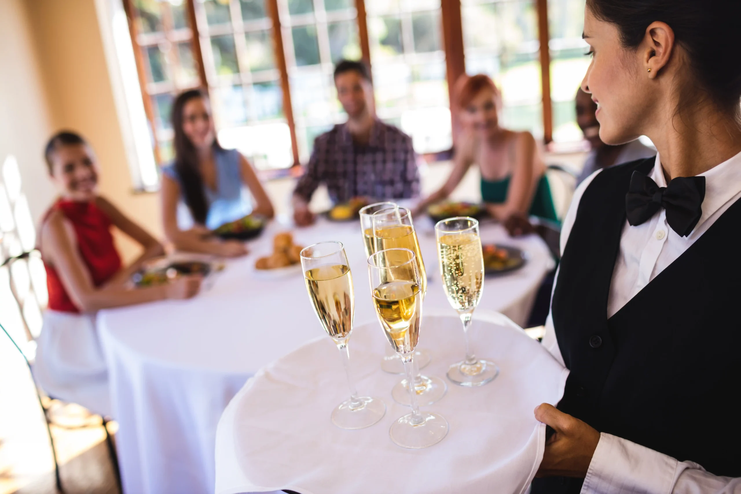 waitress-champagne-glasses-on-tray-in-restaurant-2026-03-25-02-17-14-utc